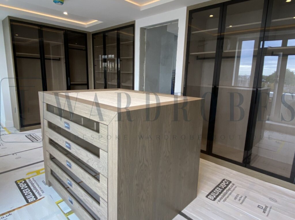 Modern glass door dressing room with black-framed glass panels in London.