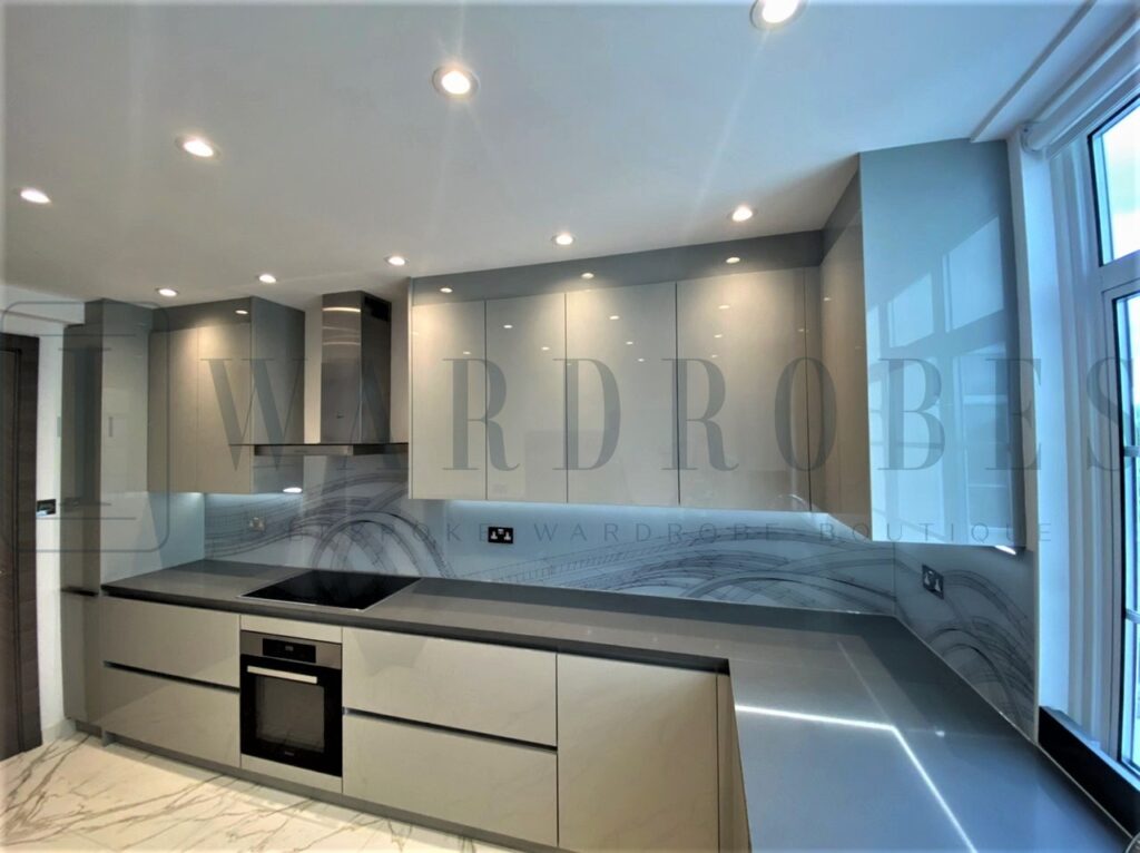 Modern high gloss fitted kitchen with sleek cabinetry and integrated appliances.