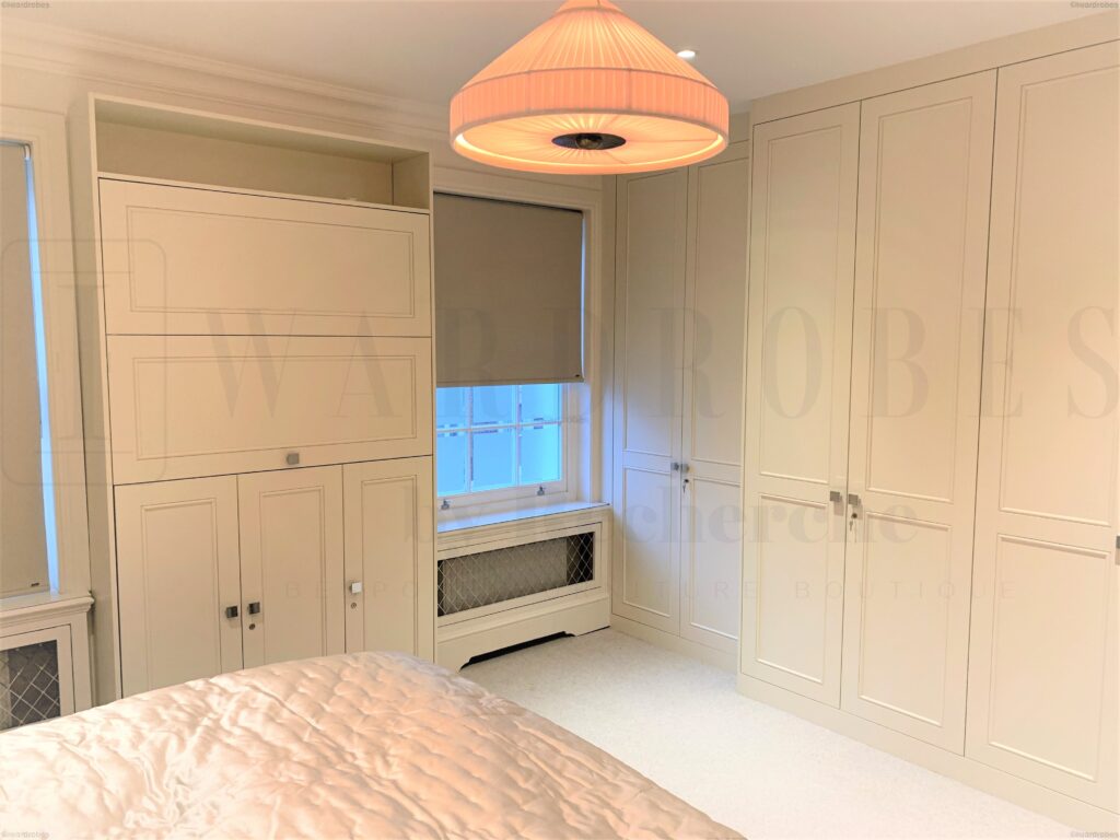 Bespoke spray painted shaker style wardrobe in a modern bedroom.