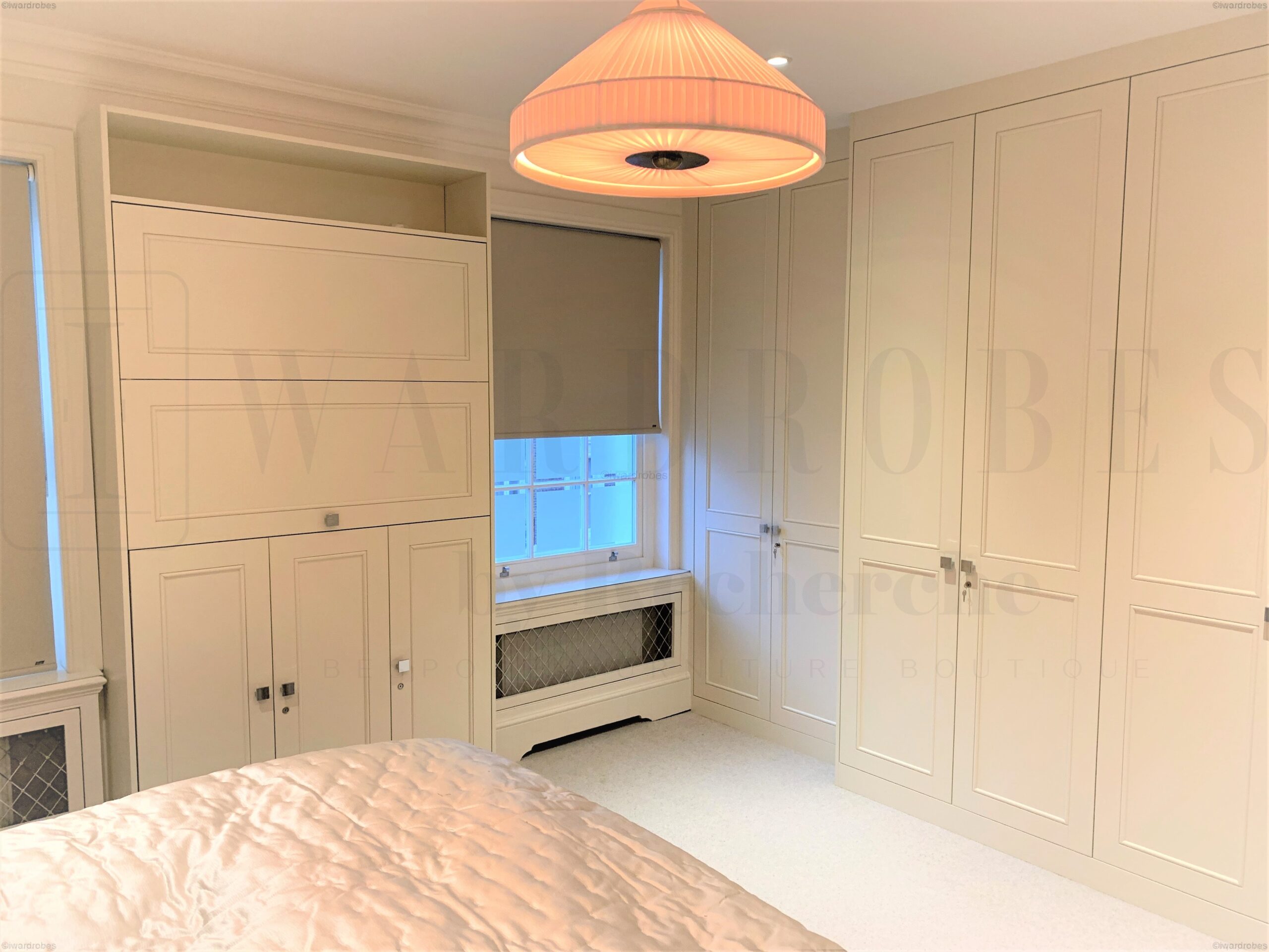 Bespoke spray painted shaker style wardrobe in a modern bedroom.